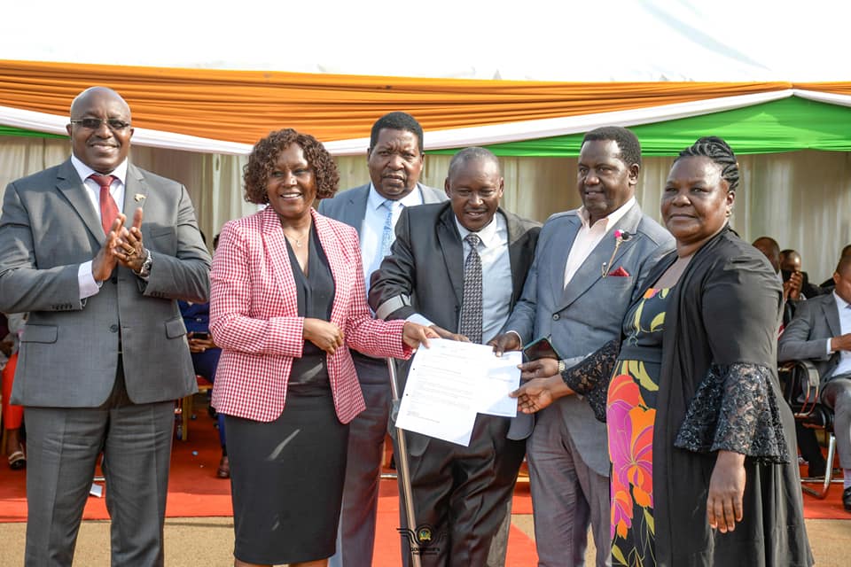 University students from Embu County receiving bursary awards